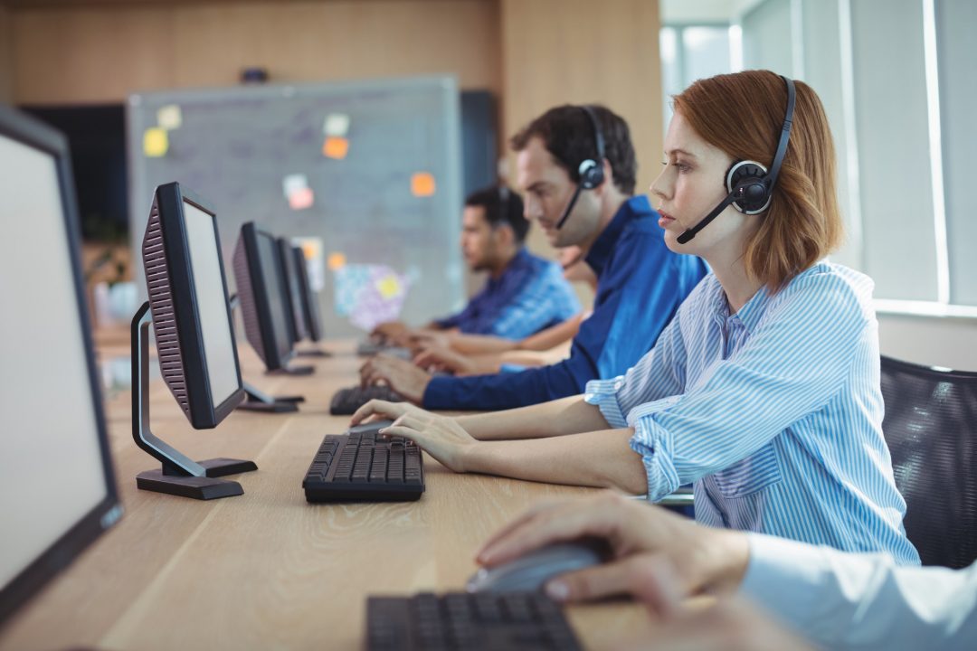 side-view-of-businesswoman-working-at-call-center